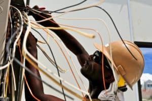 electrician doing wiring near airline employees