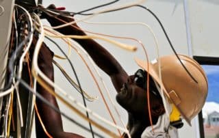 Electrician working on wiring.